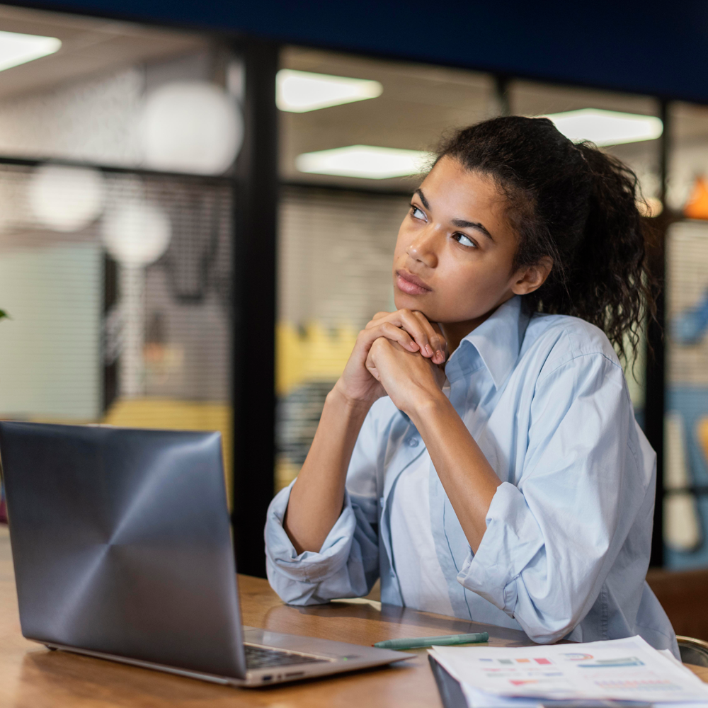 Person working on laptop in office